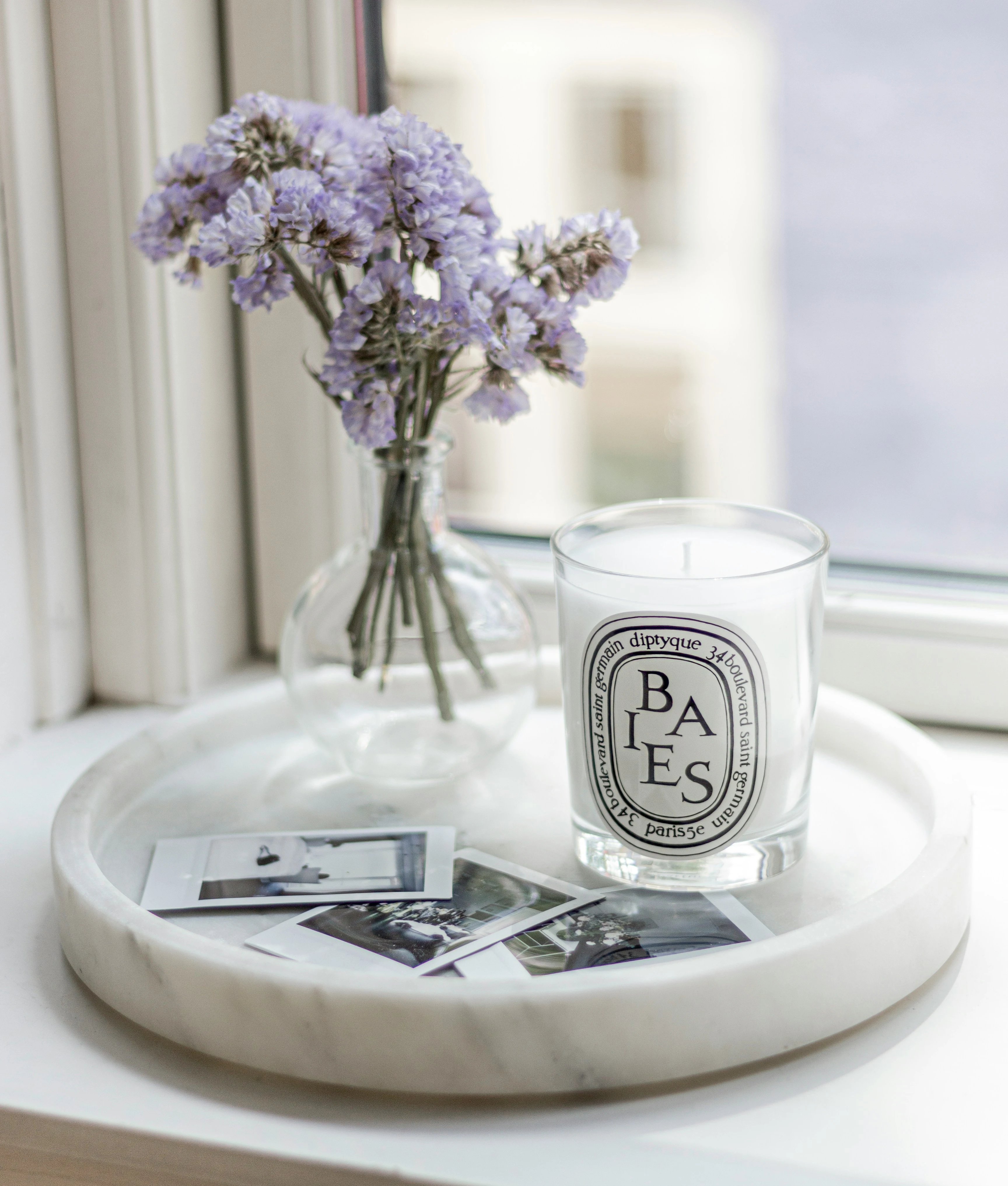 Lit scented candle creating a warm glow and cozy atmosphere in the evening
