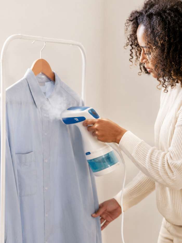Handheld clothes steamer removing wrinkles quickly without needing an ironing board